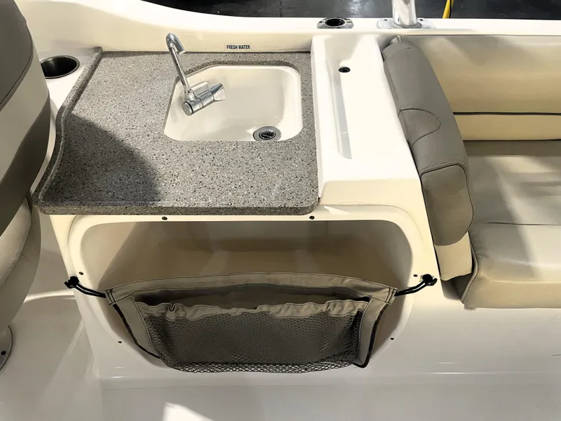 Slide: The Image of 2023 Key West 239 DFS boat interior with sink and seating area. - 32