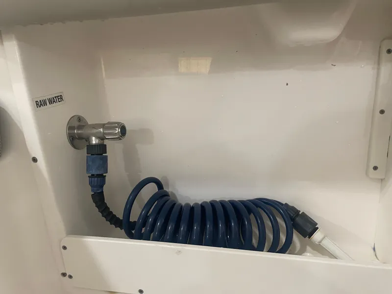 Slide: The Image of 2023 Key West 239 DFS raw water hose and faucet setup. - 35