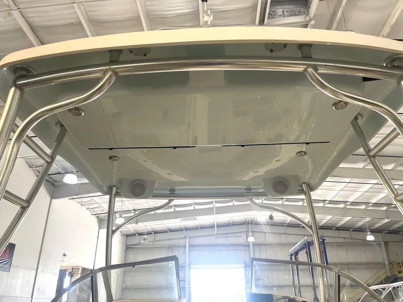 Slide: The Image of 2023 Key West 239 DFS boat hardtop in a warehouse setting. - 36