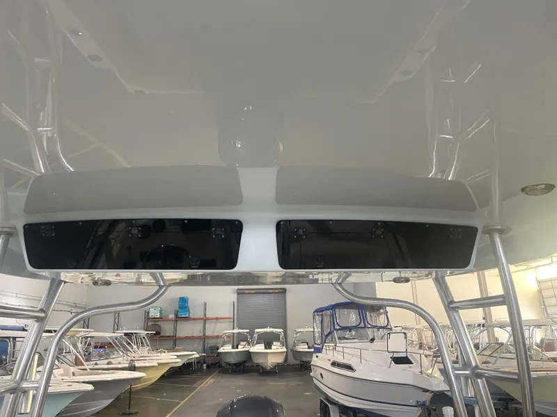 Slide: The Image of 2023 Key West 239 DFS boat interior with storage compartments in a showroom. - 38