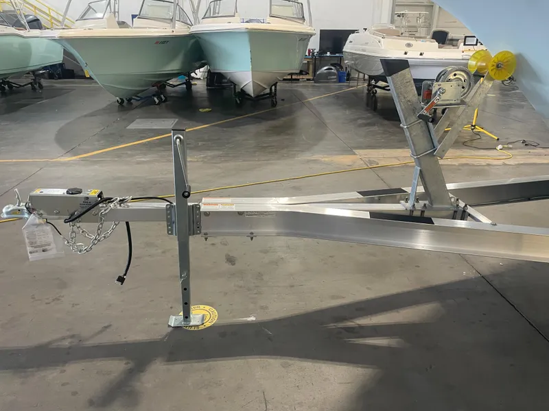 Slide: The Image of 2023 Key West 239 DFS boat trailer in a showroom with other boats. - 40