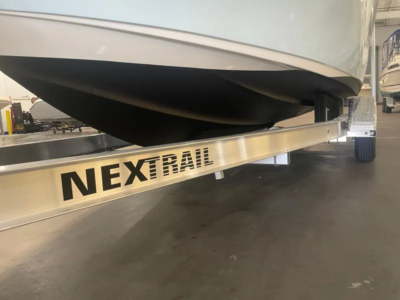 Slide: The Image of 2023 Key West 239 DFS boat on NexTrail trailer in showroom. - 41
