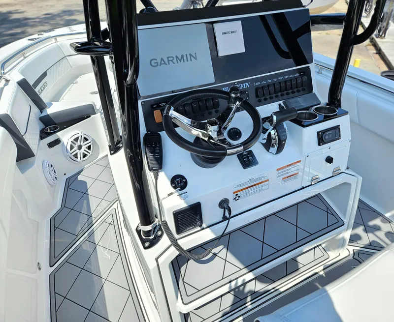 Slide: The Image of 2021 Blackfin 252 CC boat console with Garmin navigation and modern controls. - 14