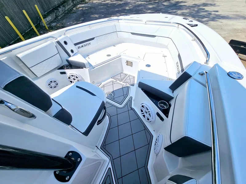 Slide: The Image of 2021 Blackfin 252 CC boat interior with seating and speakers. - 17