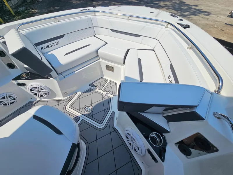 Slide: The Image of 2021 Blackfin 252 CC boat interior with cushioned seating and modern design. - 23