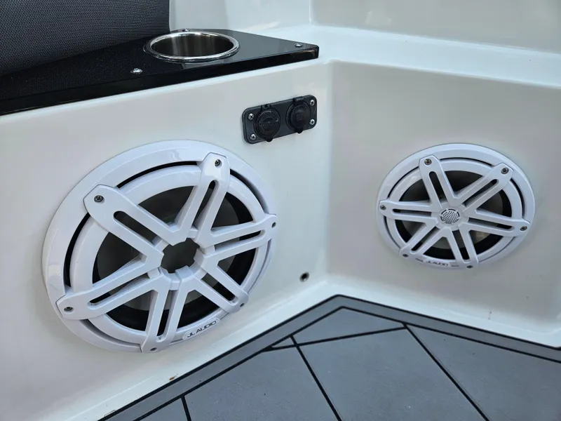 Slide: The Image of 2021 Blackfin 252 CC boat speakers and cup holder on deck. - 24