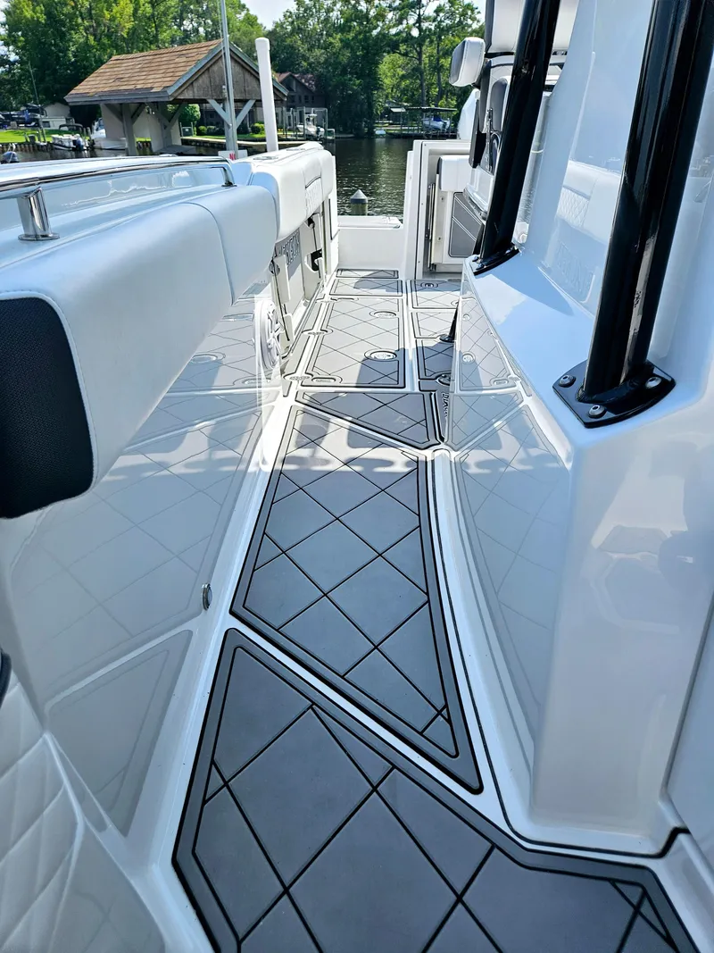 Slide: The Image of 2021 Blackfin 252 CC boat deck with sleek design and modern features. - 25