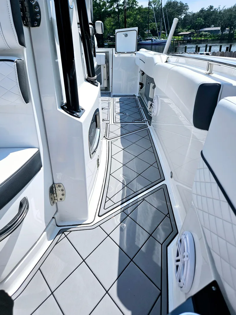 Slide: The Image of 2021 Blackfin 252 CC boat interior with sleek design and modern features. - 26