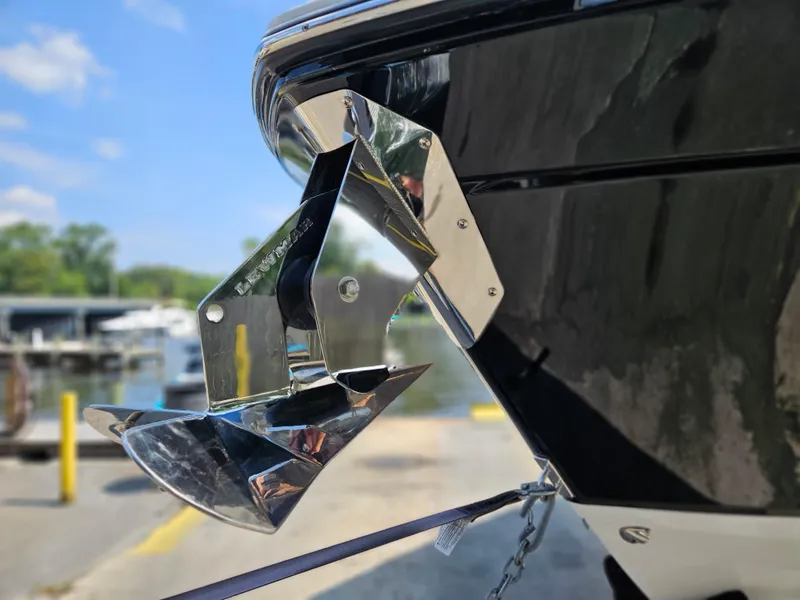 Slide: The Image of 2021 Blackfin 252 CC boat with a shiny stainless steel anchor at the bow. - 33