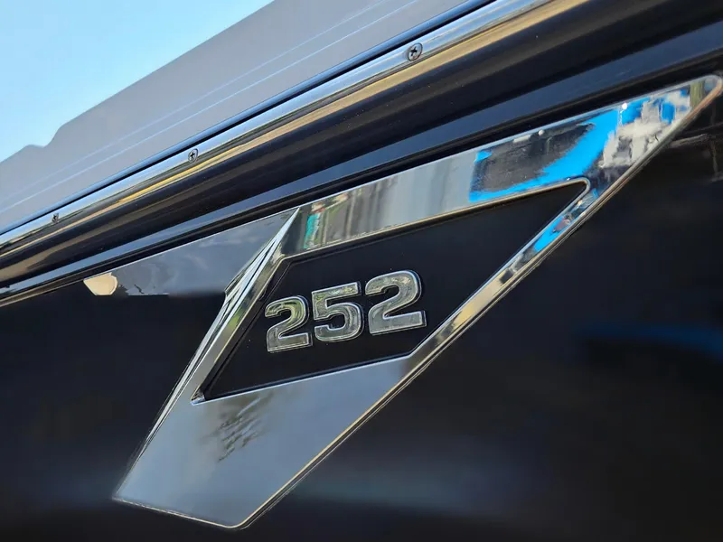 Slide: The Image of 2021 Blackfin 252 CC boat emblem with chrome detailing. - 4