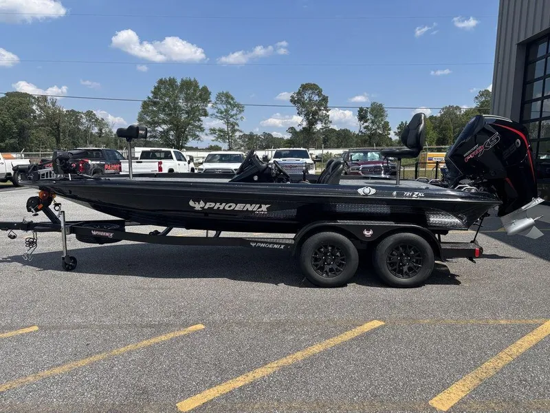 The Image of 2026 Phoenix 721 ZXL boat on trailer in parking lot, sunny day. - 1