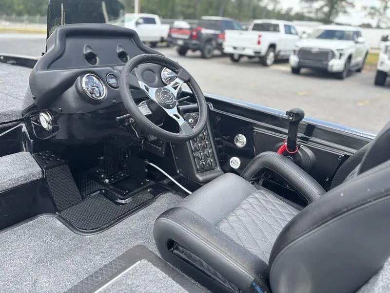 Slide: The Image of 2026 Phoenix 721 ZXL boat interior with steering wheel and control panel. - 13