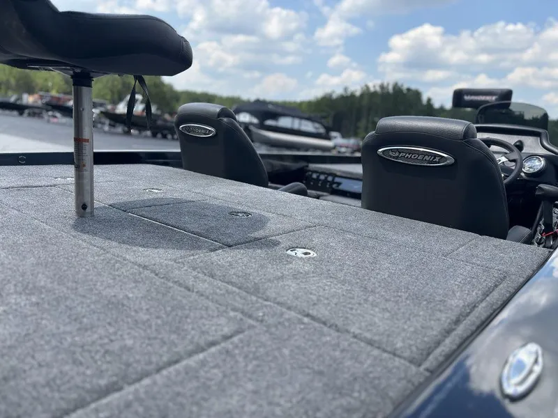 Slide: The Image of 2026 Phoenix 721 ZXL boat interior with cushioned seating and fishing platform. - 18