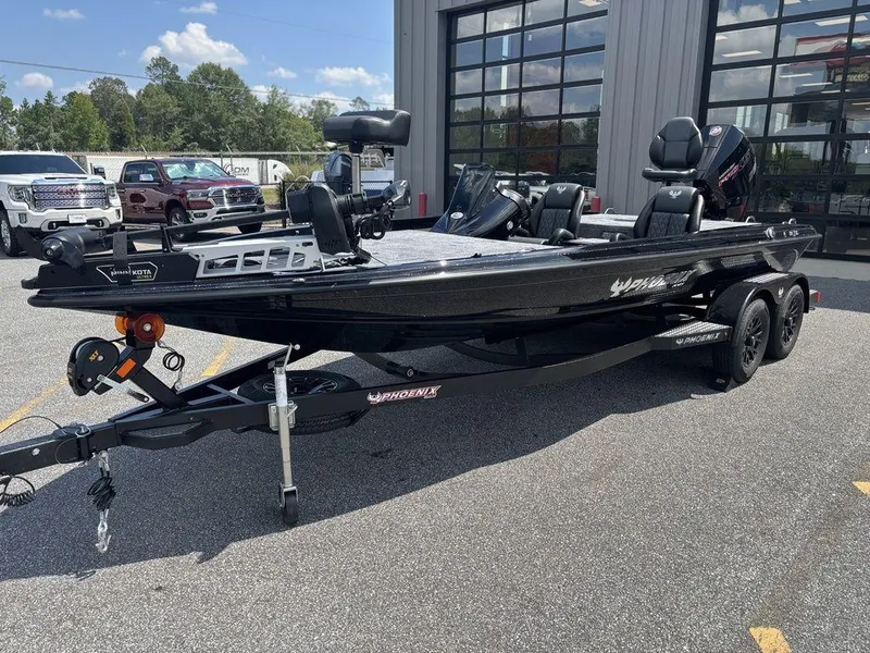 Slide: The Image of 2026 Phoenix 721 ZXL boat on trailer, parked outside dealership, sunny day. - 3