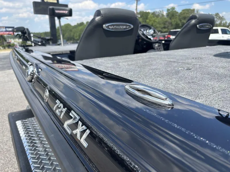 Slide: The Image of 2026 Phoenix 721 ZXL boat, sleek design, close-up view, outdoor setting. - 4