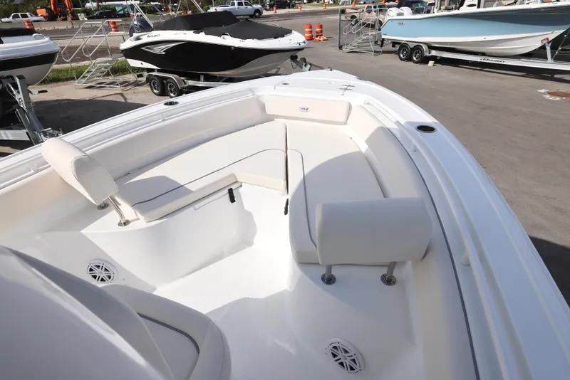 Slide: The Image of 2025 Sea Hunt Ultra 245 SE boat with spacious seating and sleek design. - 10