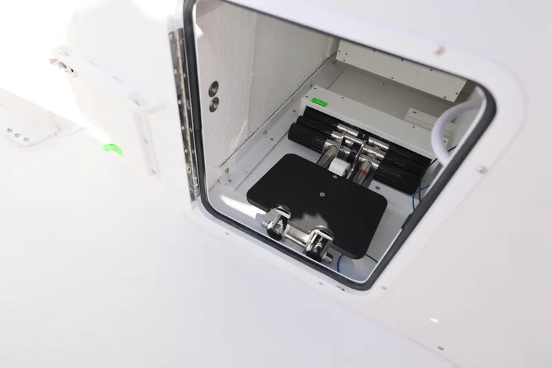 Slide: The Image of 2025 Sea Hunt Ultra 245 SE boat storage compartment detail. - 19