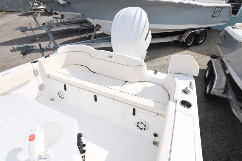 Slide: The Image of 2025 Sea Hunt Ultra 245 SE boat with spacious seating and modern design. - 5