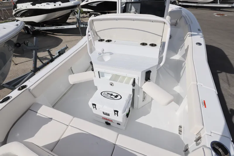 Slide: The Image of 2025 Sea Hunt Ultra 245 SE boat interior with seating and storage. - 7