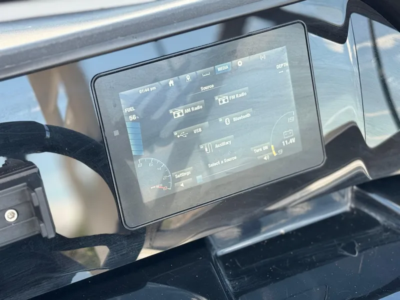 Slide: The Image of Dashboard of 2022 Yamaha Boats AR 195 S with touchscreen display and controls. - 29