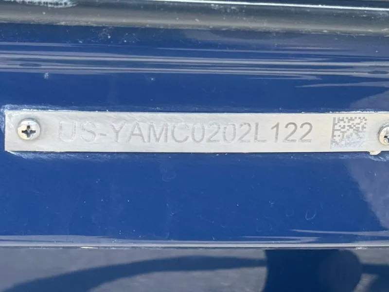 Slide: The Image of Yamaha Boats AR 195 S 2022 hull identification number plate on blue surface. - 32