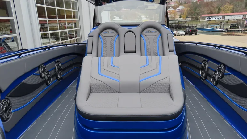 Slide: The Image of Luxury interior of 2025 MTI 42V boat with blue and gray seating. - 14