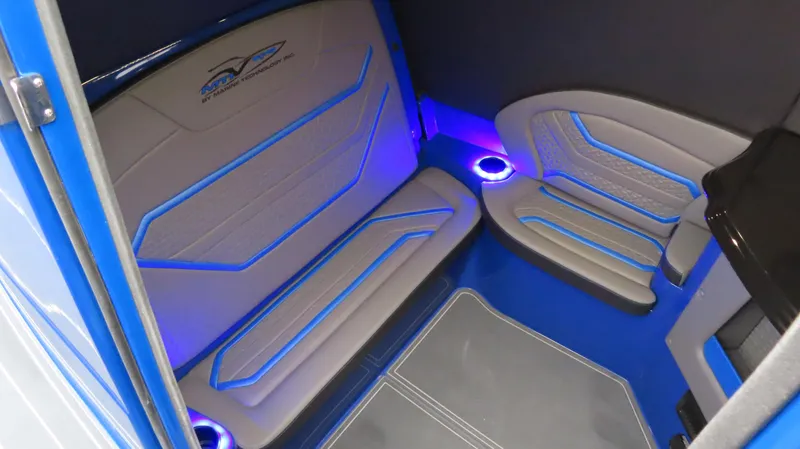 Slide: The Image of Interior of 2025 MTI 42V boat with blue LED lighting and modern seating. - 17