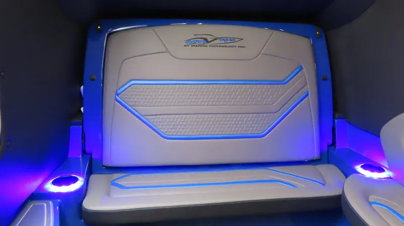 Slide: The Image of Interior of 2025 MTI 42V boat with blue LED lighting and modern seating design. - 18