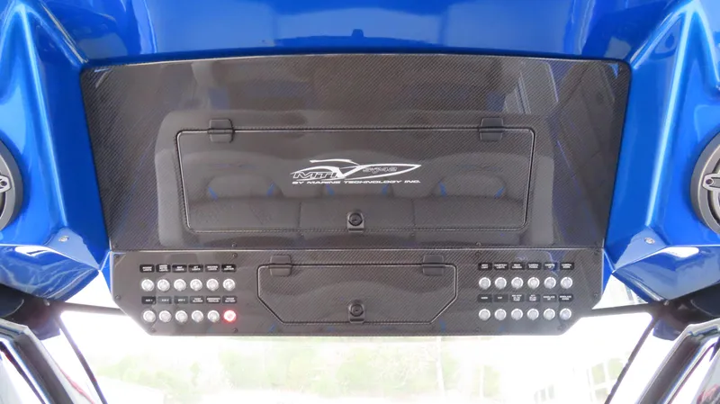 Slide: The Image of Control panel of 2025 MTI 42V boat with carbon fiber finish and buttons. - 22