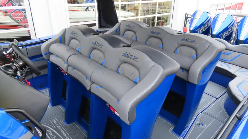 Slide: The Image of 2025 MTI 42V boat interior with blue and gray seating, showcasing modern design. - 24