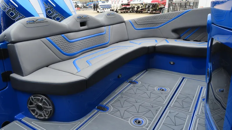 Slide: The Image of Luxurious seating in a 2025 MTI 42V boat, featuring blue and gray upholstery. - 9