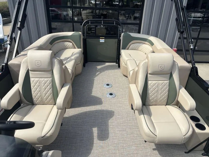 Slide: The Image of Luxurious seating on 2026 Godfrey SWEETWATER 2286 SB pontoon boat, featuring elegant beige upholstery. - 16