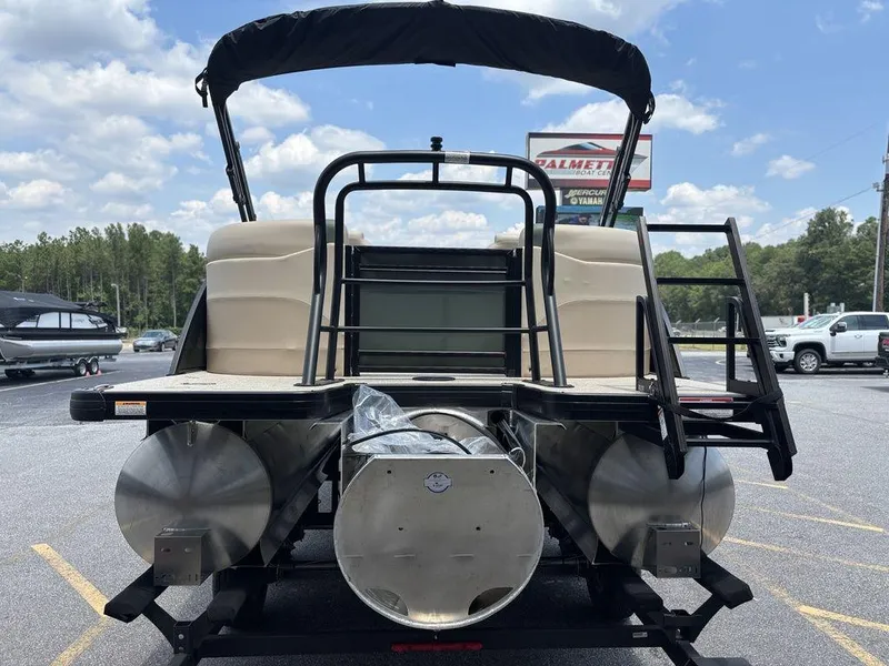 Slide: The Image of 2026 Godfrey SWEETWATER 2286 SB pontoon boat rear view in parking lot. - 7