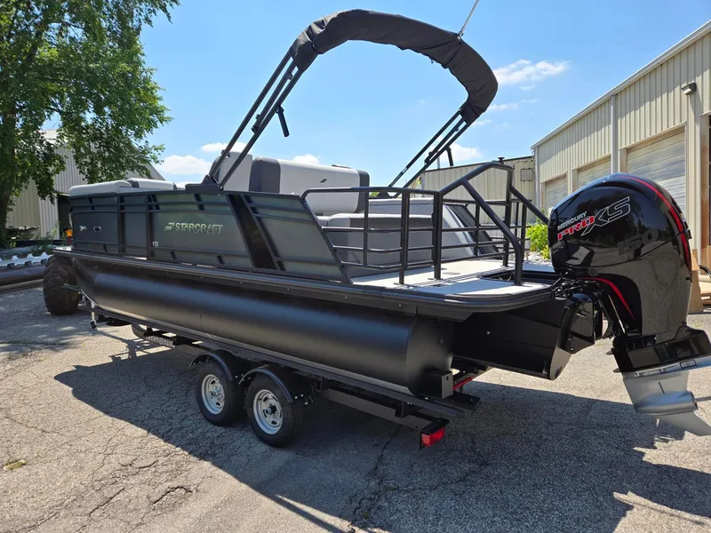 Slide: The Image of 2026 Starcraft EXS1QDH pontoon boat with Mercury Pro XS engine, parked outdoors. - 3