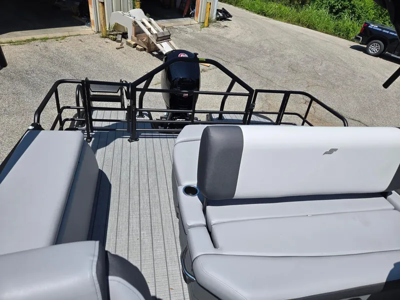 Slide: The Image of 2026 Starcraft EXS1QDH boat interior with gray seating and outboard motor. - 7