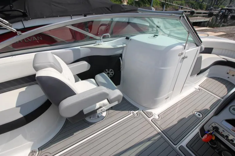 Slide: The Image of 2015 Cruisers Sport Series 238 Bow Rider interior with seating and helm. - 17