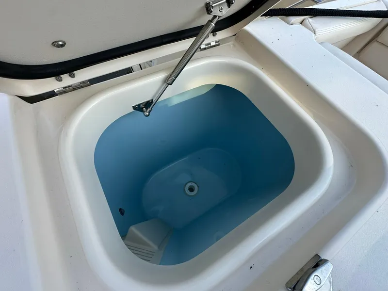 Slide: The Image of Livewell compartment on 2024 Grady-White Freedom 335 boat, open lid view. - 10
