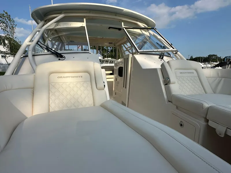 Slide: The Image of 2024 Grady-White Freedom 335 boat interior with luxurious seating and modern design. - 16