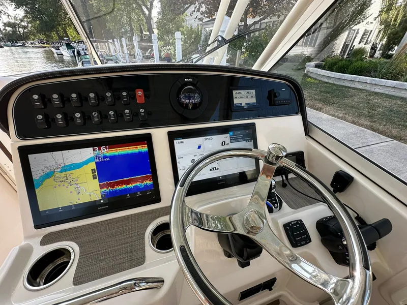 Slide: The Image of 2024 Grady-White Freedom 335 helm with advanced navigation displays and controls. - 26