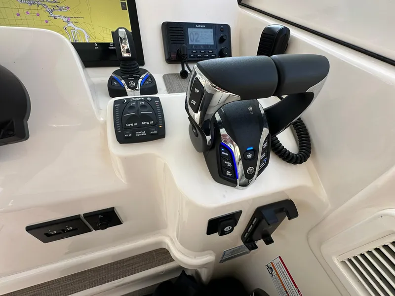 Slide: The Image of 2024 Grady-White Freedom 335 helm with advanced controls and navigation display. - 27