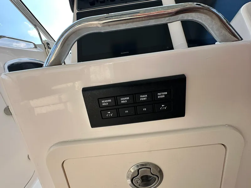 Slide: The Image of Control panel on 2024 Grady-White Freedom 335 boat dashboard. - 29