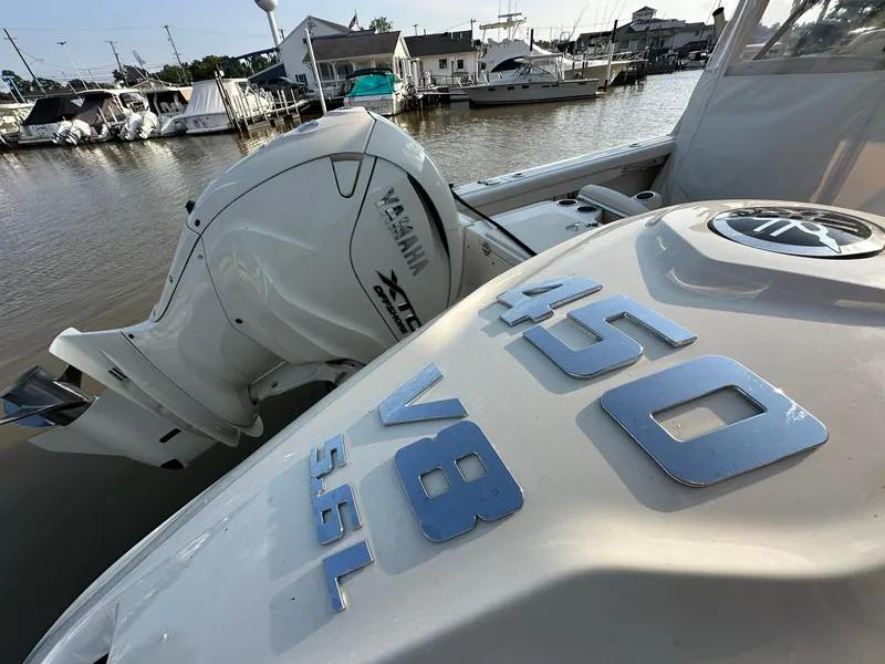 Slide: The Image of 2024 Grady-White Freedom 335 boat with Yamaha 450 V8 engine at marina. - 3