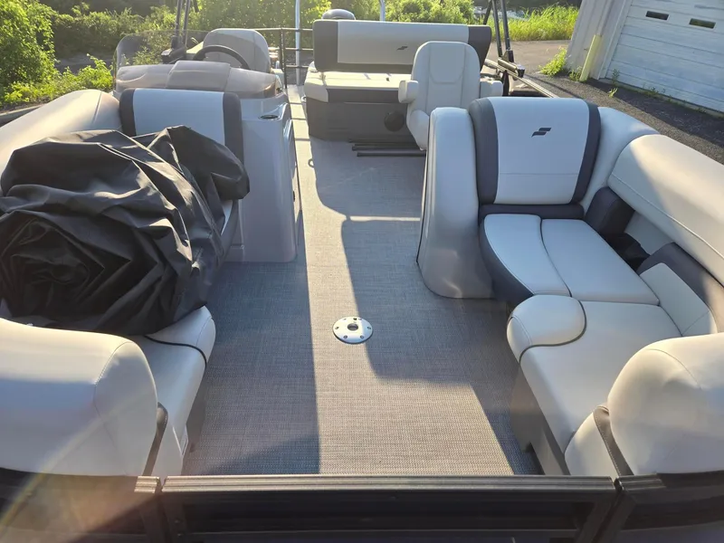 Slide: The Image of 2026 Starcraft EX22QDH pontoon boat interior with plush seating and spacious layout. - 5