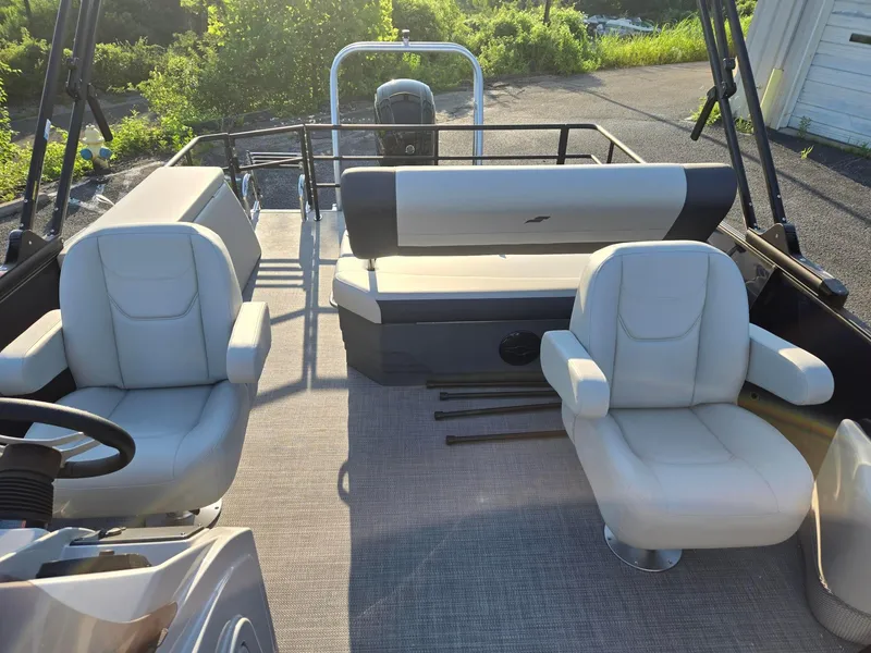 Slide: The Image of 2026 Starcraft EX22QDH boat interior with plush seating and modern design. - 6