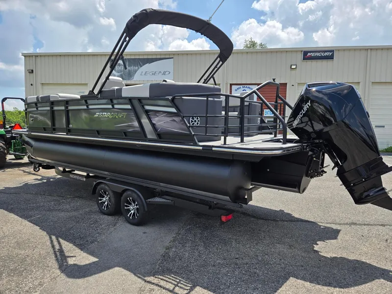 Slide: The Image of 2026 Starcraft SLS3R pontoon boat with Mercury outboard motor on trailer. - 3