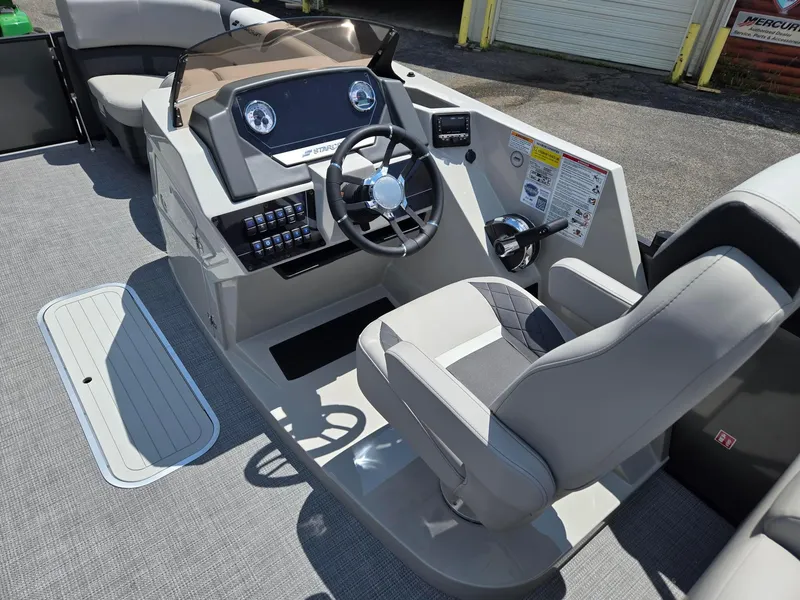 Slide: The Image of 2026 Starcraft SLS3R boat cockpit with steering wheel and control panel. - 7