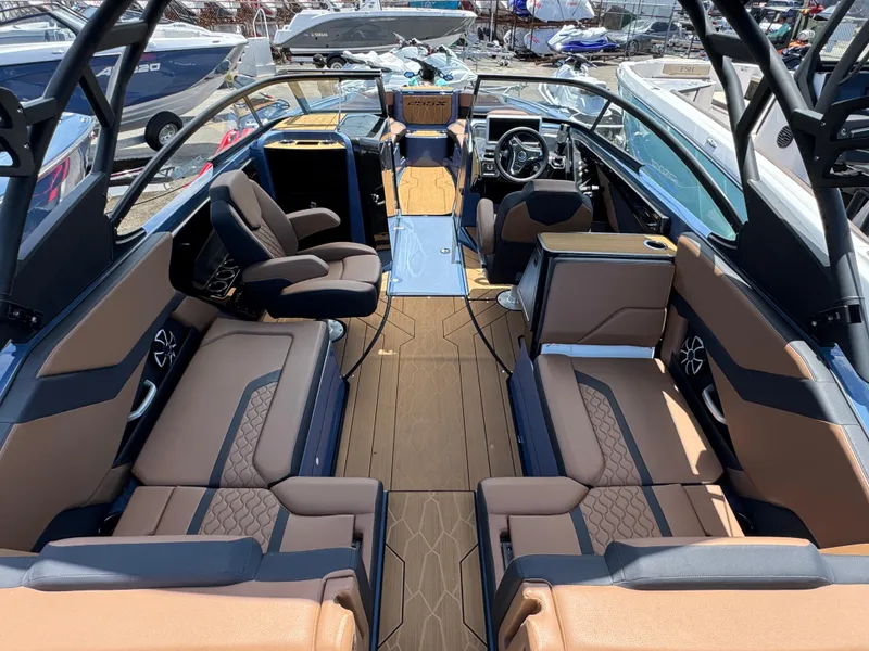 Slide: The Image of 2024 Yamaha Boats 255XD interior with luxurious seating and modern dashboard. - 11