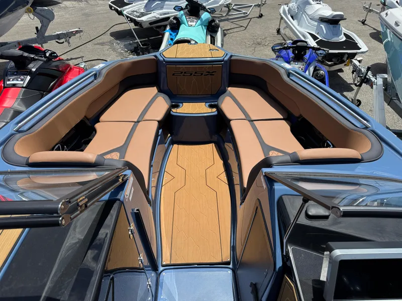 Slide: The Image of 2024 Yamaha Boats 255XD interior with tan seating and sleek design. - 13