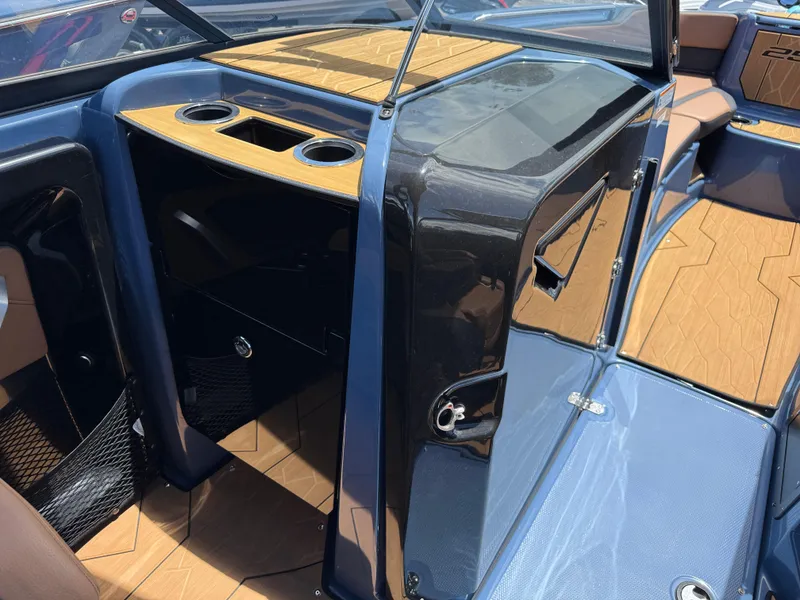 Slide: The Image of 2024 Yamaha Boats 255XD interior with sleek design and wood accents. - 18
