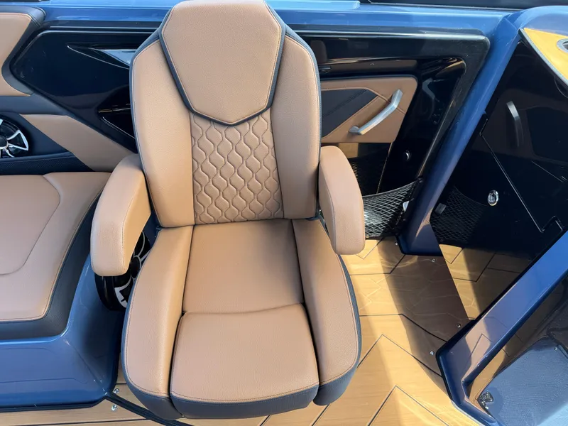 Slide: The Image of Luxurious seating on 2024 Yamaha Boats 255XD, featuring tan upholstery and modern design. - 19